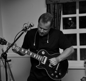 Captain Dave — lead guitar and vocals